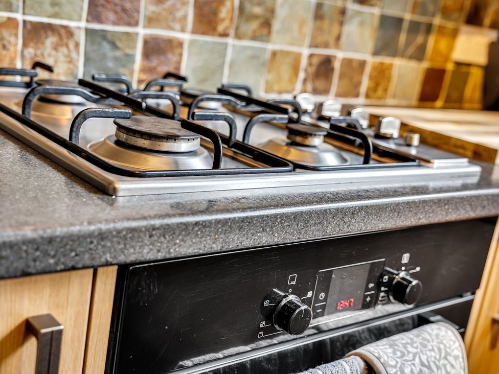 A gas stove with controls and a countertop in Stoke Townhouse Stoke-on-Trent