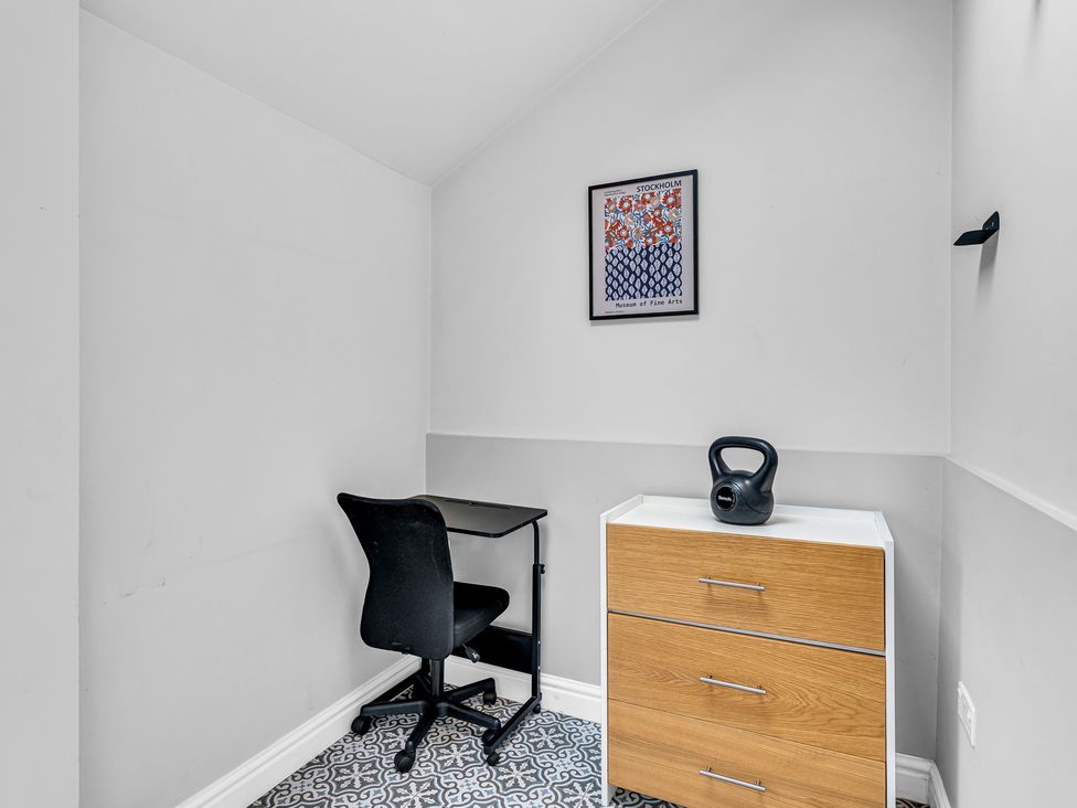 A home office with a desk and chair at Stoke Townhouse in Stoke-on-Trent
