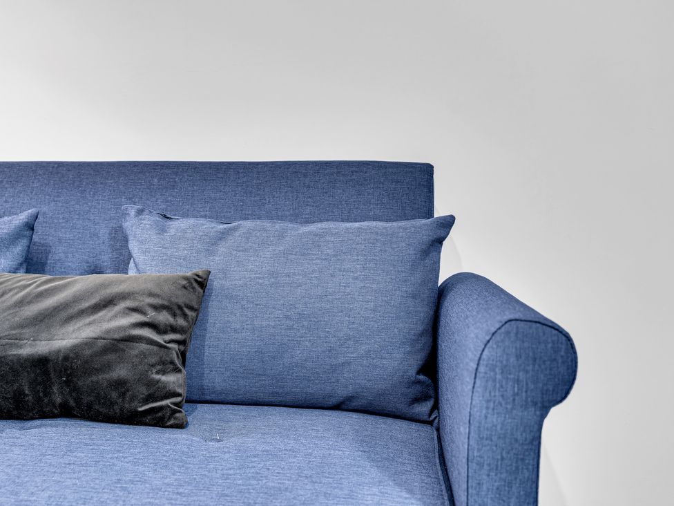 A sofa with cushions at Victoria House, Stoke on Trent