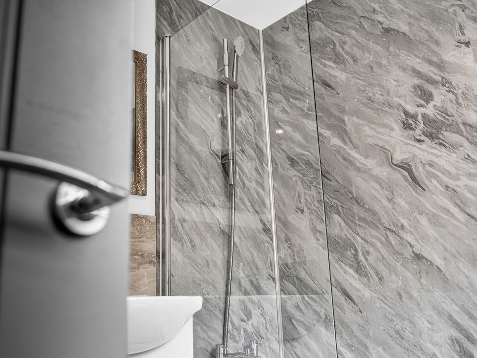 A bathroom with a shower and toilet at Victoria House, Stoke on Trent
