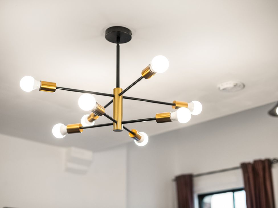 A chandelier with light bulbs at The Hallmark Birmingham Flat Birmingham