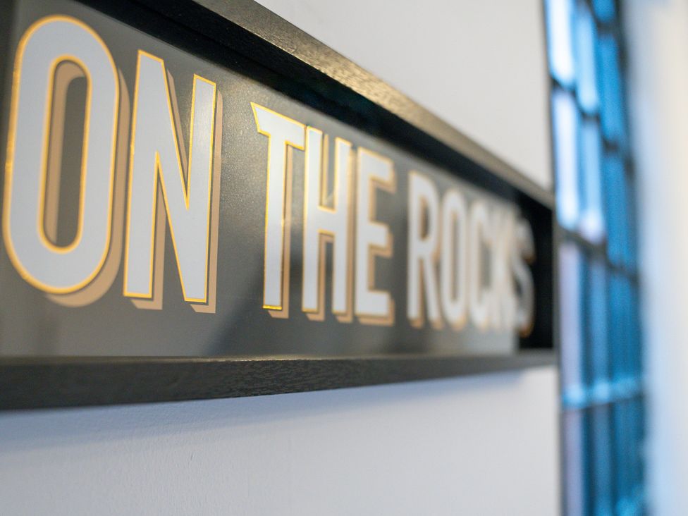A sign that reads ON THE ROCKS