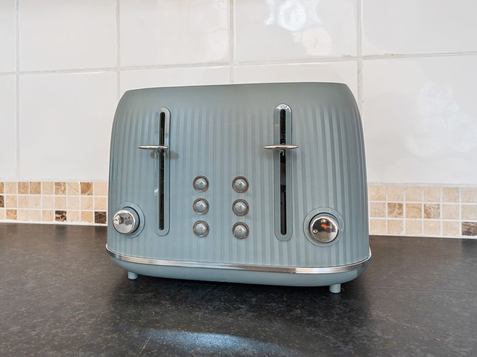 A toaster on a kitchen countertop at The Gilder Birmingham City Apartment Birmingham