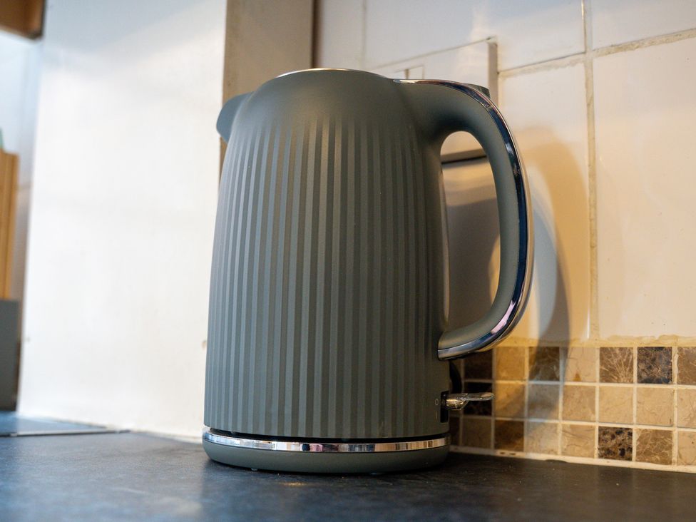 An electric kettle on a kitchen counter at The Gilder Birmingham City Apartment