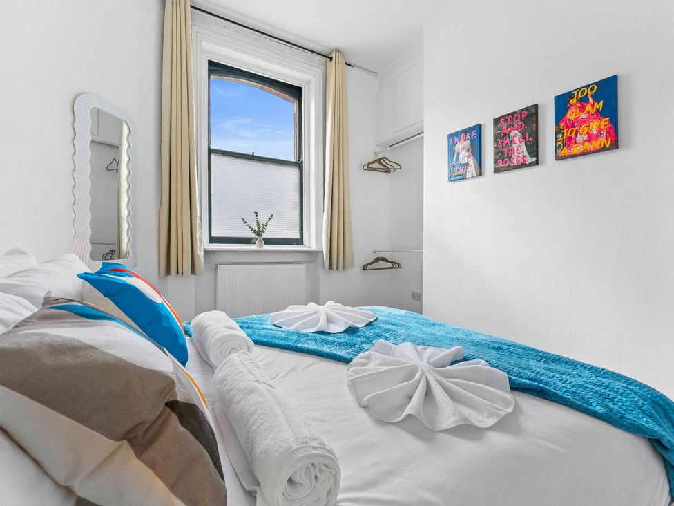 A bedroom with a bed and a window at The Gilder Birmingham City Apartment Birmingham