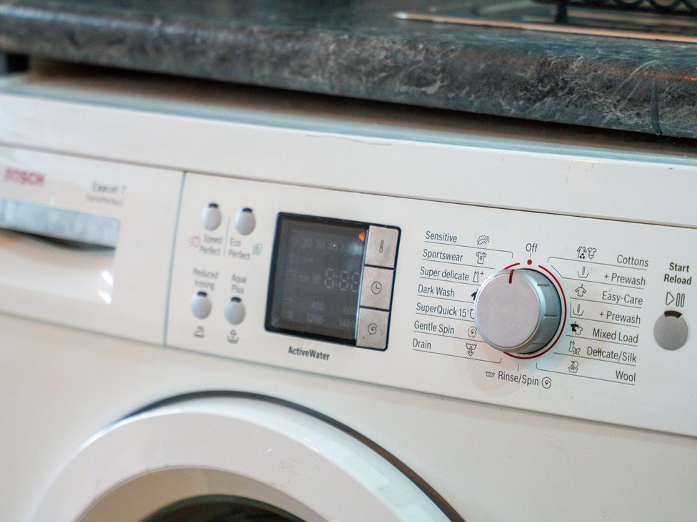 A washing machine control panel at The Craftsman Birmingham City Apartment Birmingham