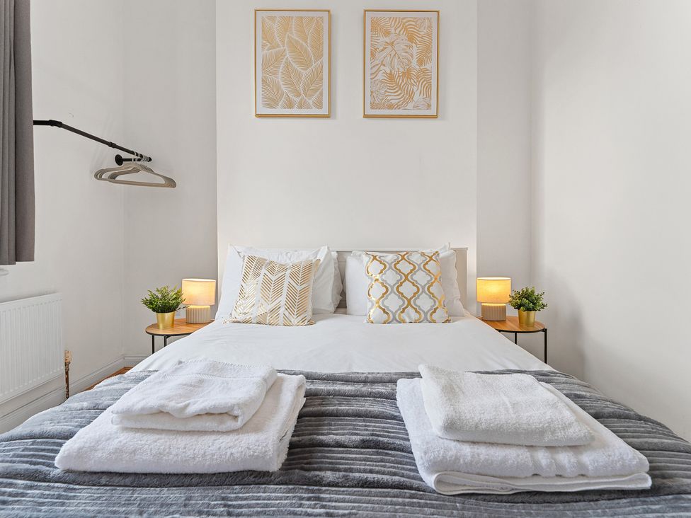 A bedroom with a bed and decor at The Goldsmith Birmingham City Apartment Birmingham