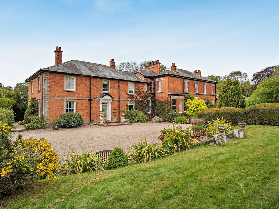 A house with a garden and pathway at Staunton Park in Leominster