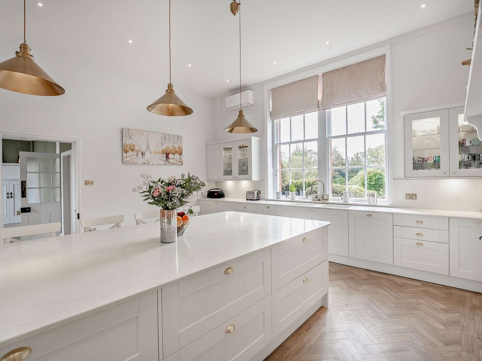 A kitchen with an island and window at Staunton Park in Leominster