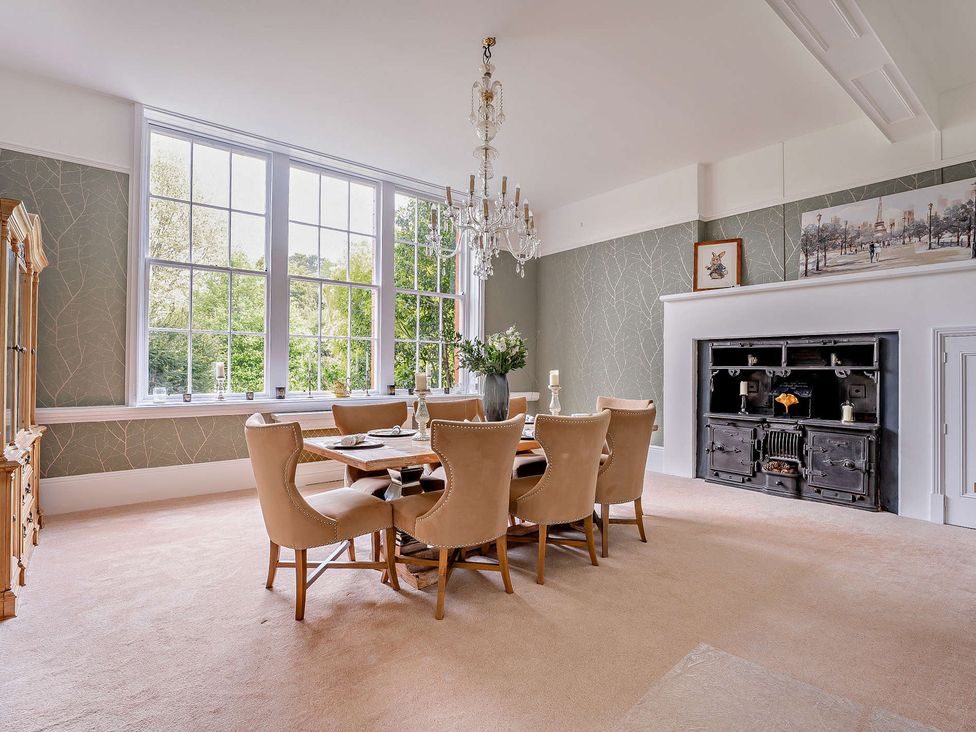A dining room with a table and chairs at Staunton Park in Leominster