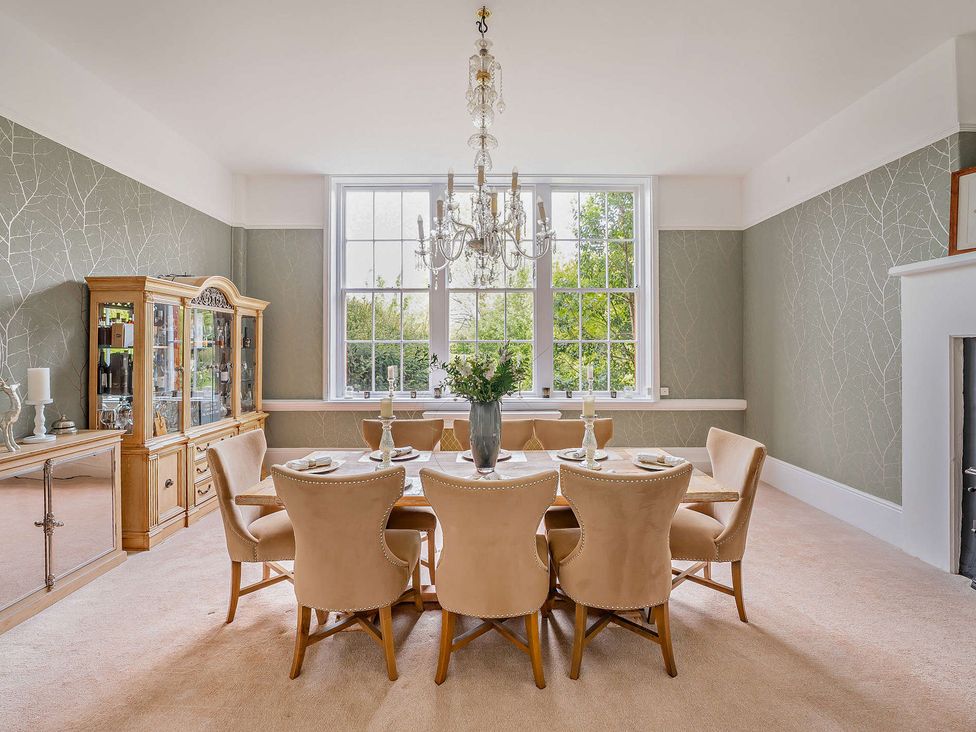 A dining room with a table and chairs at Staunton Park in Leominster