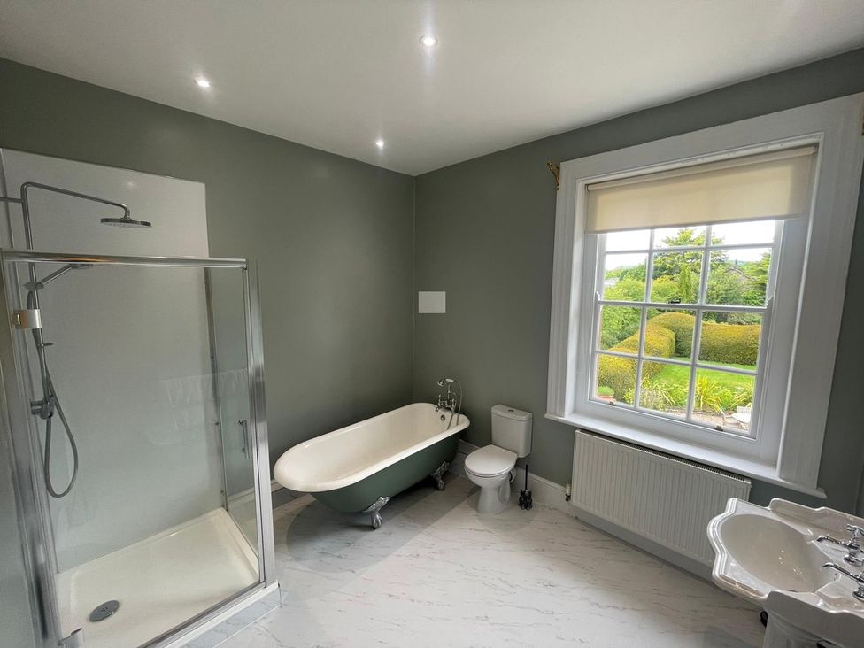 A bathroom with a bathtub and shower at Staunton Park in Leominster