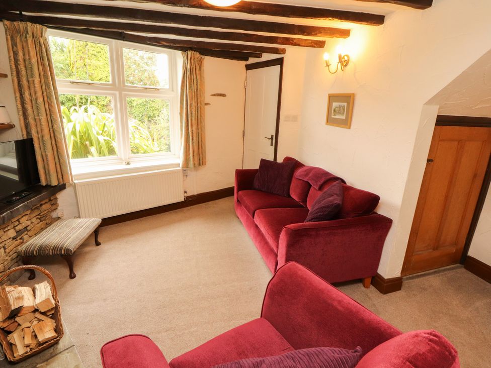 A living room with two sofas and a window at The Orchard in Levens