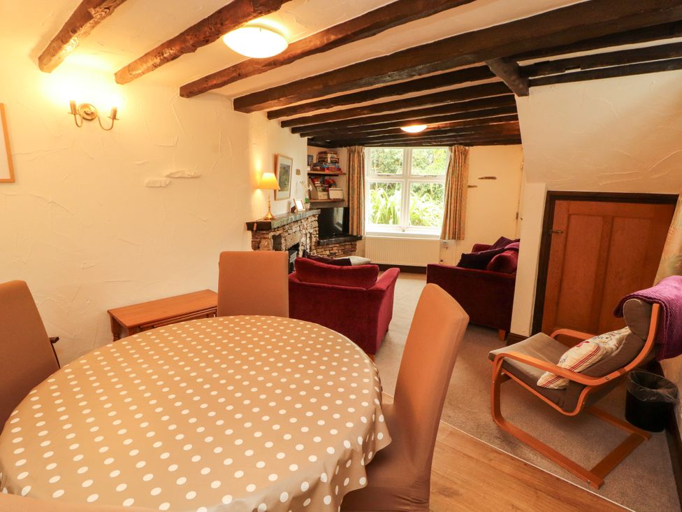 A dining room with a table and chairs at The Orchard in Levens
