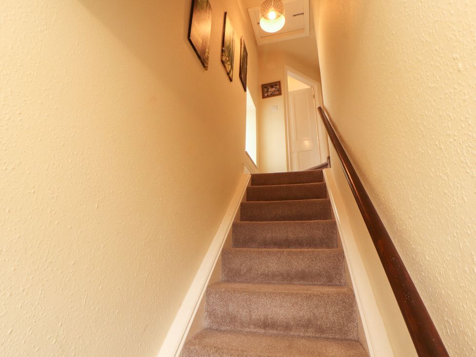 A staircase leading to a hallway at The Orchard in Levens
