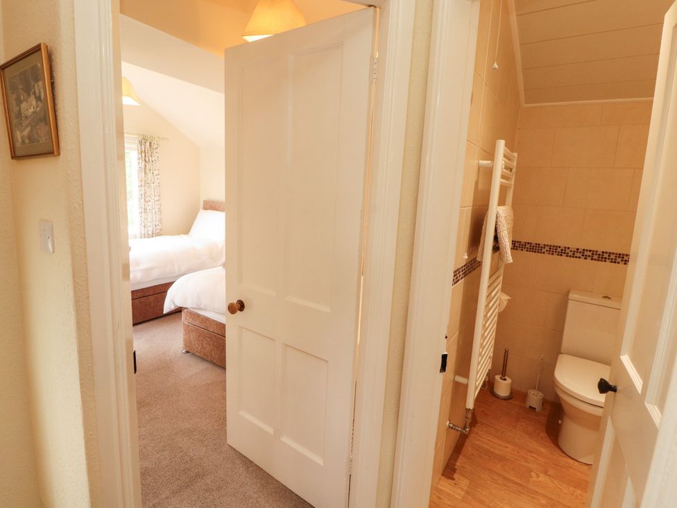 A bathroom with a toilet and towel radiator at The Orchard in Levens