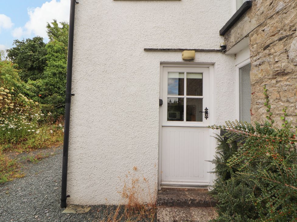 An exterior door with plants beside it at The Orchard in Levens
