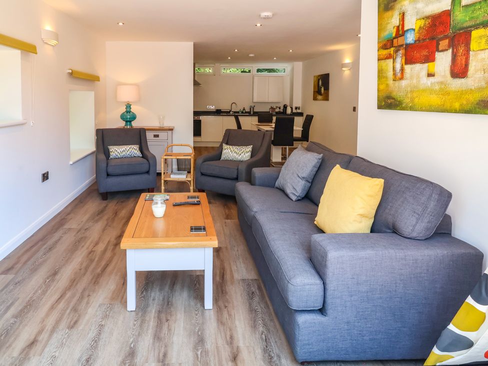 A living room with two armchairs and a sofa at Down Cottage in Zeal Monachorum