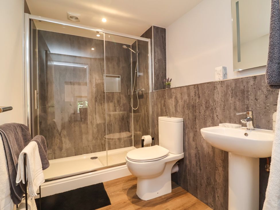 A bathroom with shower, toilet, and sink at Down Cottage in Zeal Monachorum