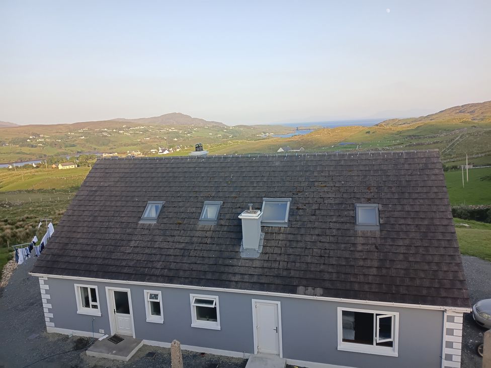 A house with a grey exterior and chimney at Sliabh League Mountain Lodge TEILEANN near Kilcar, County Donegal