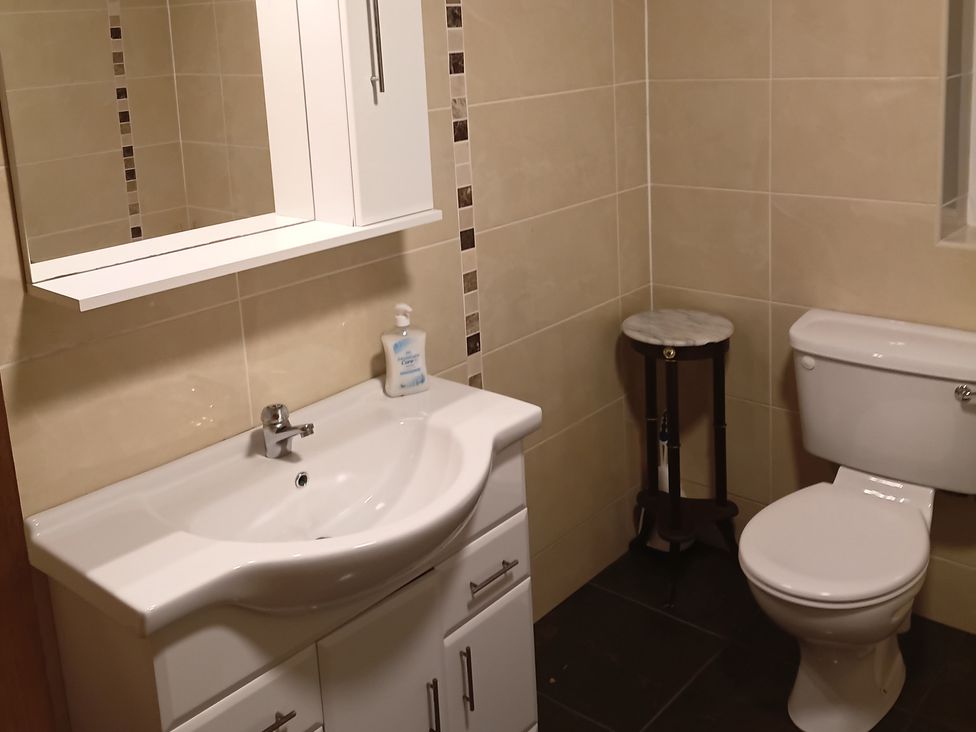 A bathroom with a sink and toilet at Sliabh League Mountain Lodge TEILEANN near Kilcar, County Donegal