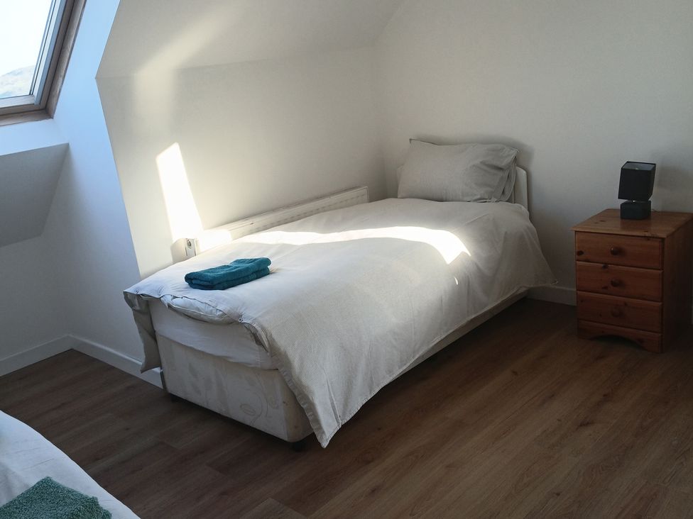 A bedroom with a bed and a bedside table at Sliabh League Mountain Lodge TEILEANN near Kilcar, County Donegal