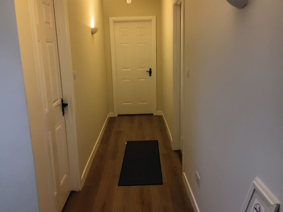 A hallway with doors and a floor mat at Sliabh League Mountain Lodge TEILEANN near Kilcar, County Donegal