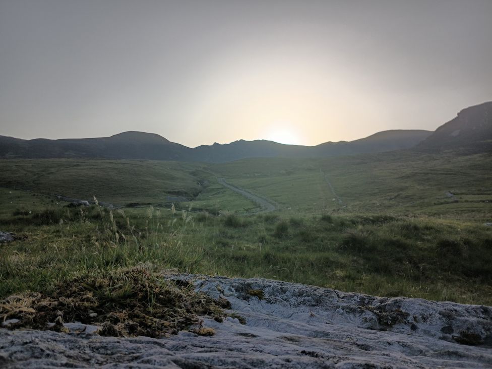 A view of mountains and a pathway in the grassland at Sliabh League Mountain Lodge TEILEANN near Kilcar, County Donegal