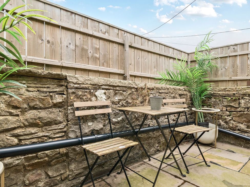 An outdoor space with a table and chairs at Hillside House Leyburn