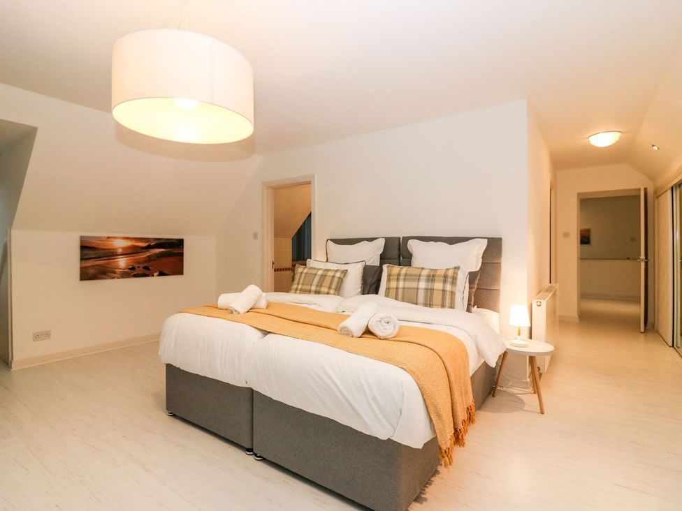 A bedroom with a bed and a bedside table at Boat House in Aberdeen