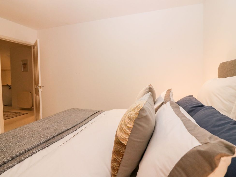 A bedroom with a bed and door at Boat House in Aberdeen
