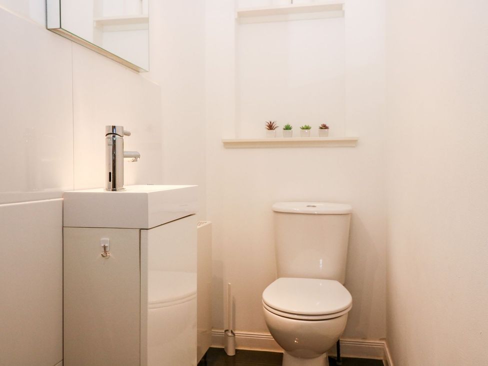 A bathroom with a sink and toilet at Boat House in Aberdeen