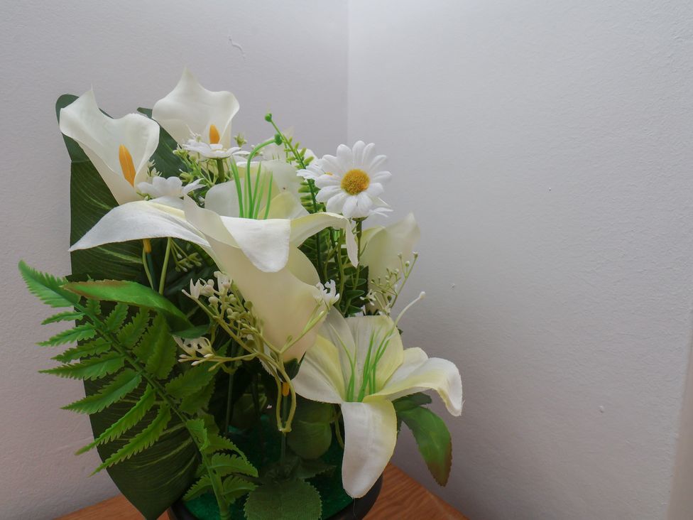 A plant arrangement with flowers at K & J Holiday House in Bridlington