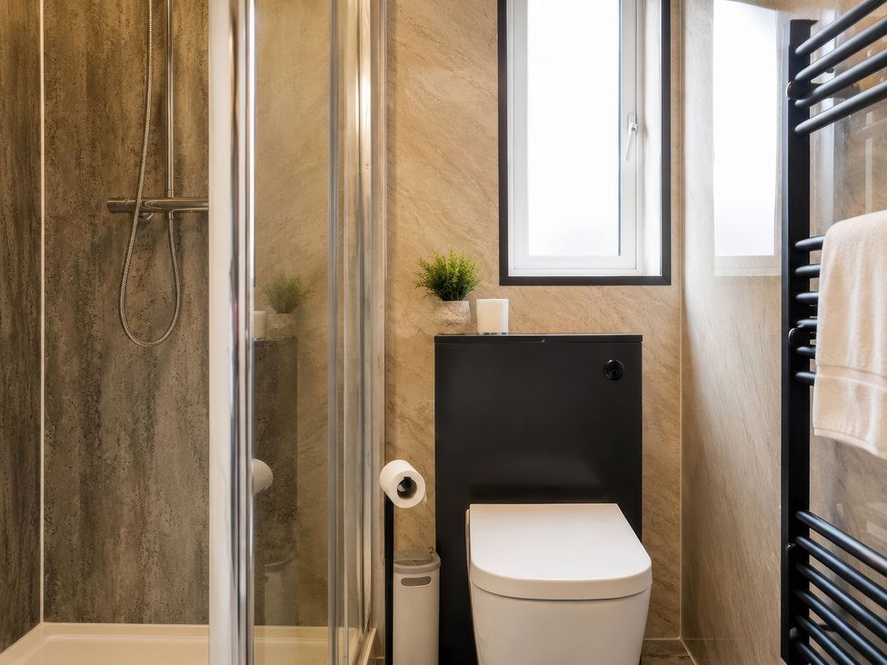 A bathroom with a shower and toilet at 4 Britannia Street Salford
