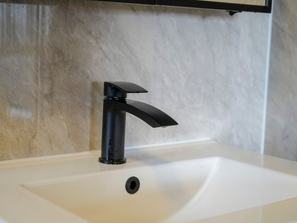 A faucet above a sink in a bathroom at 4 Britannia Street, Salford
