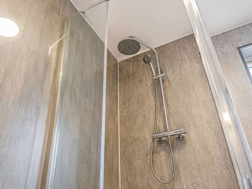 A shower with a handheld showerhead and water control valve at 4 Britannia Street in Salford