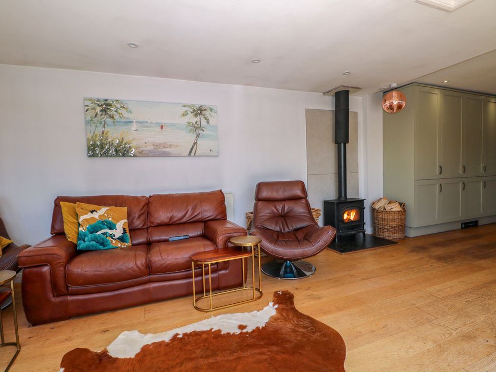A living room with a sofa and an armchair at Perry Dees in Minstead