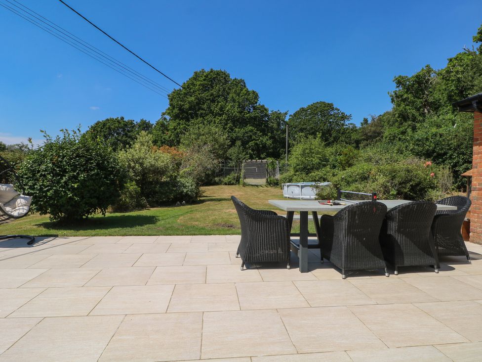 A patio area with table and chairs at Perry Dees in Minstead