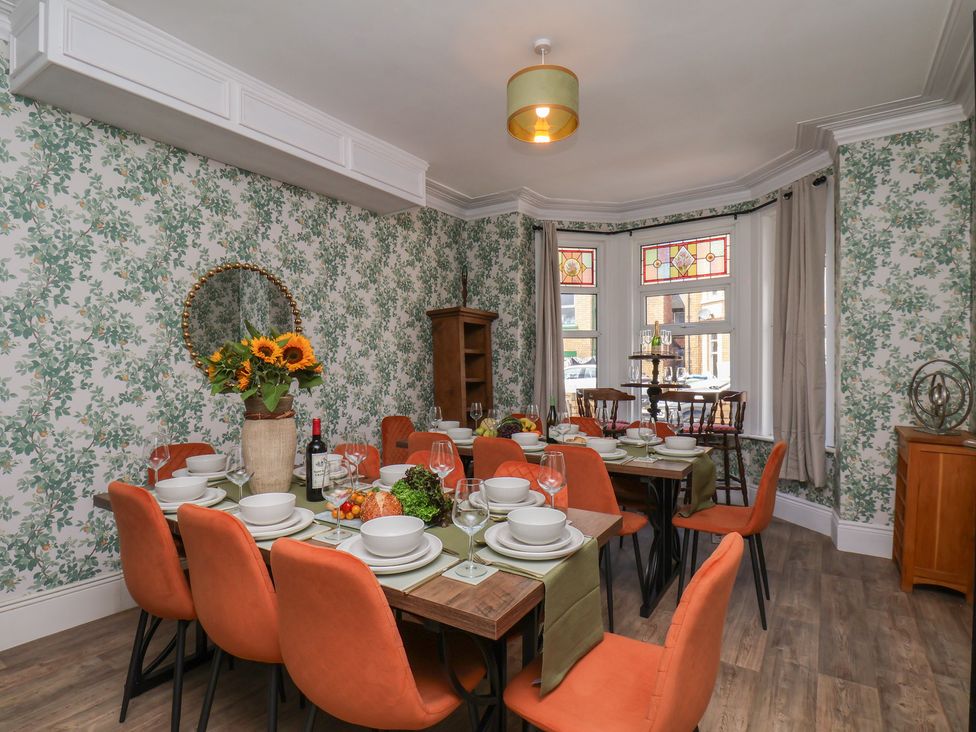 A dining room with a table set for dinner at Lansdowne Grange in Bridlington