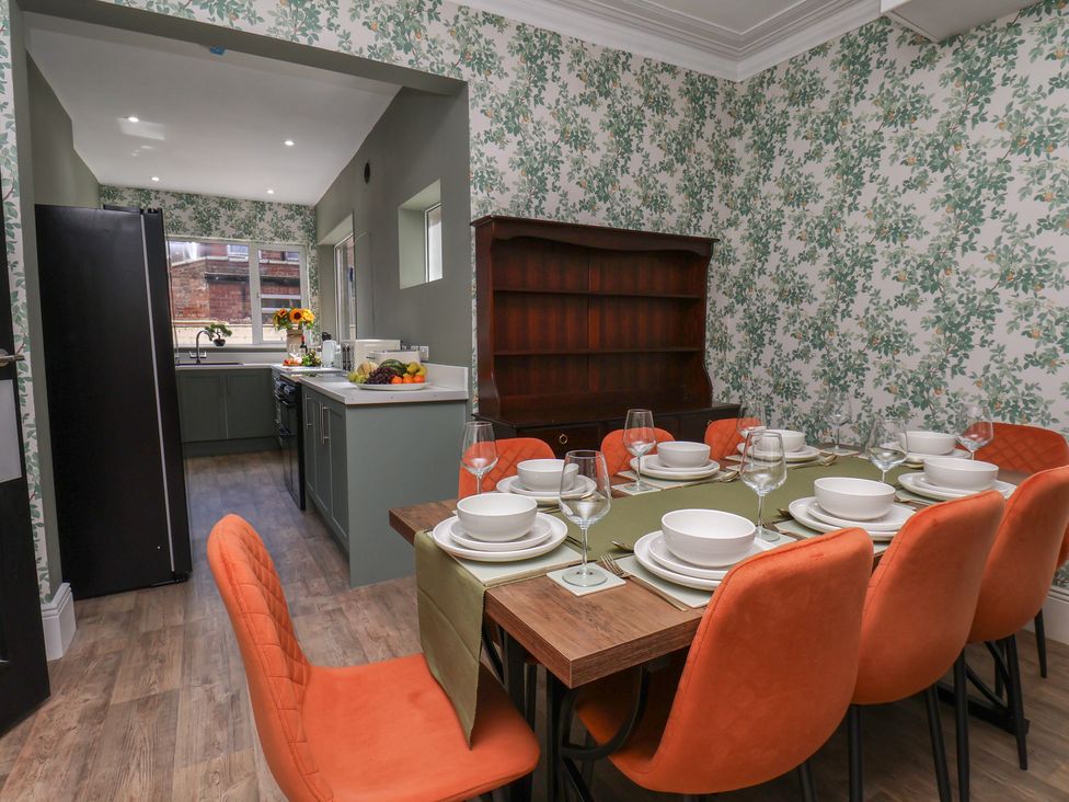 A dining room with a table set for dinner at Lansdowne Grange in Bridlington