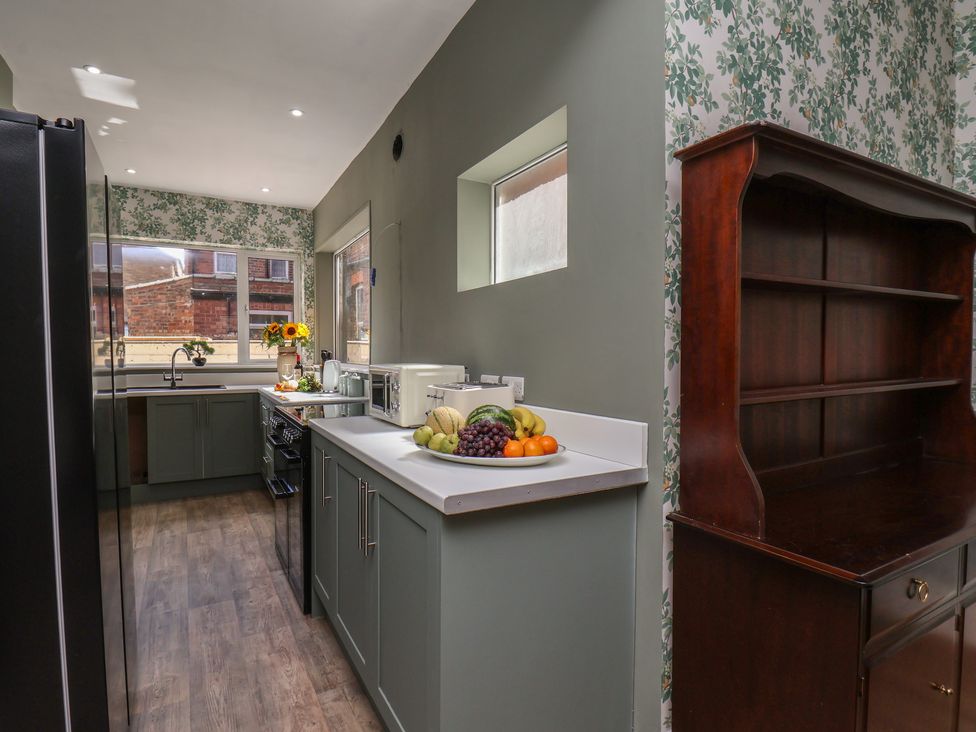 A kitchen with a countertop and appliances at Lansdowne Grange in Bridlington