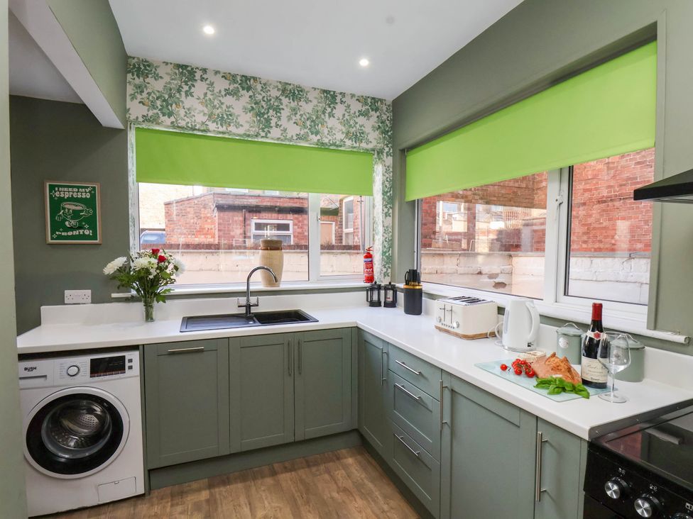 A kitchen with a sink and appliances at Lansdowne Grange in Bridlington
