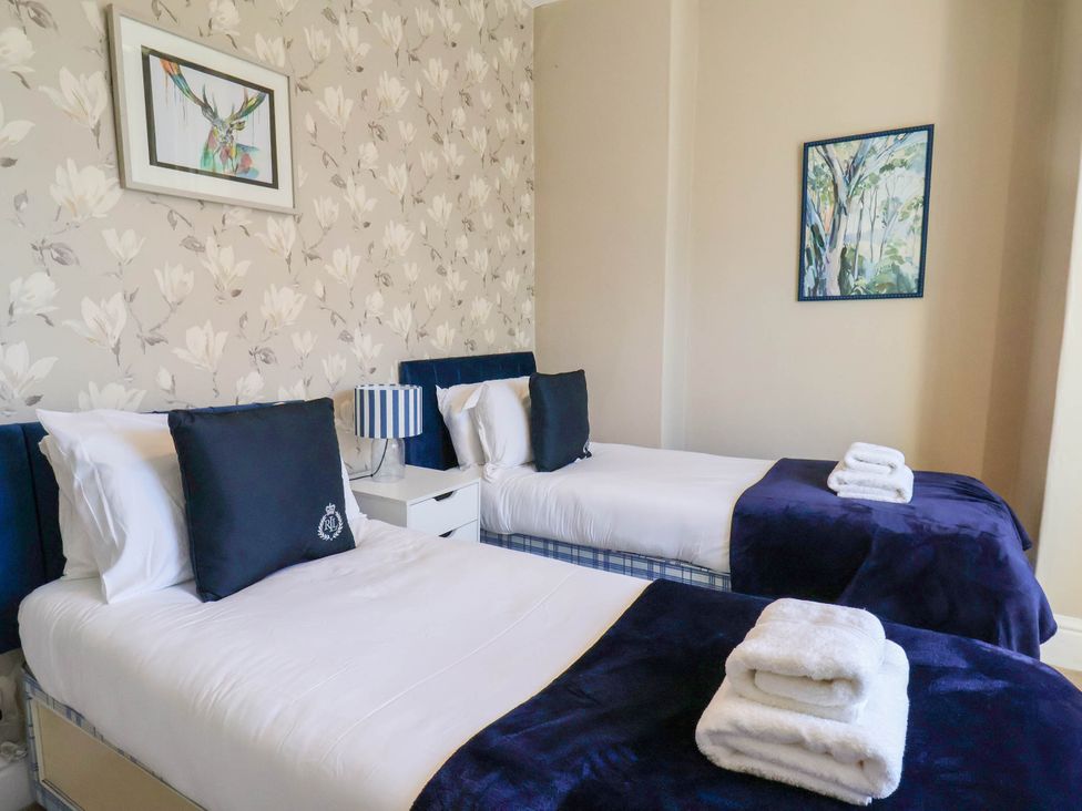 A bedroom with two beds at Lansdowne Grange in Bridlington