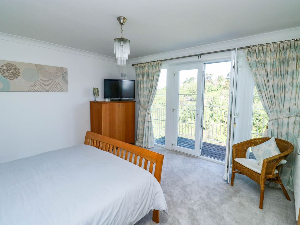 A bedroom with a bed and television at 2 Inglewood Apartments in Dartmouth