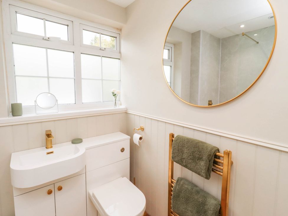 A bathroom with a sink and toilet at Hedley Dene Cottage in Longhorsley