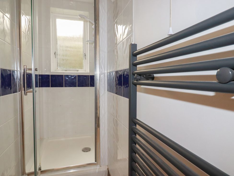 A shower area with a window at Newseal House 