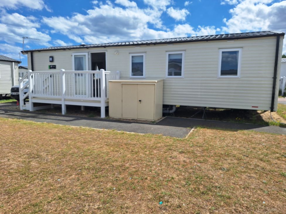 A mobile home with a deck and steps at Haven Seashore, Ellerton Willerby Xtra, Great Yarmouth