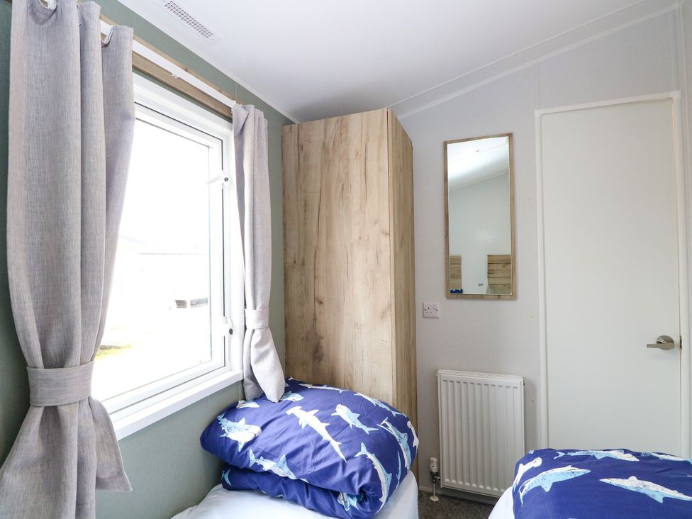 A bedroom with bed and window at Haven Seashore, Ellerton Willerby Xtra Great Yarmouth