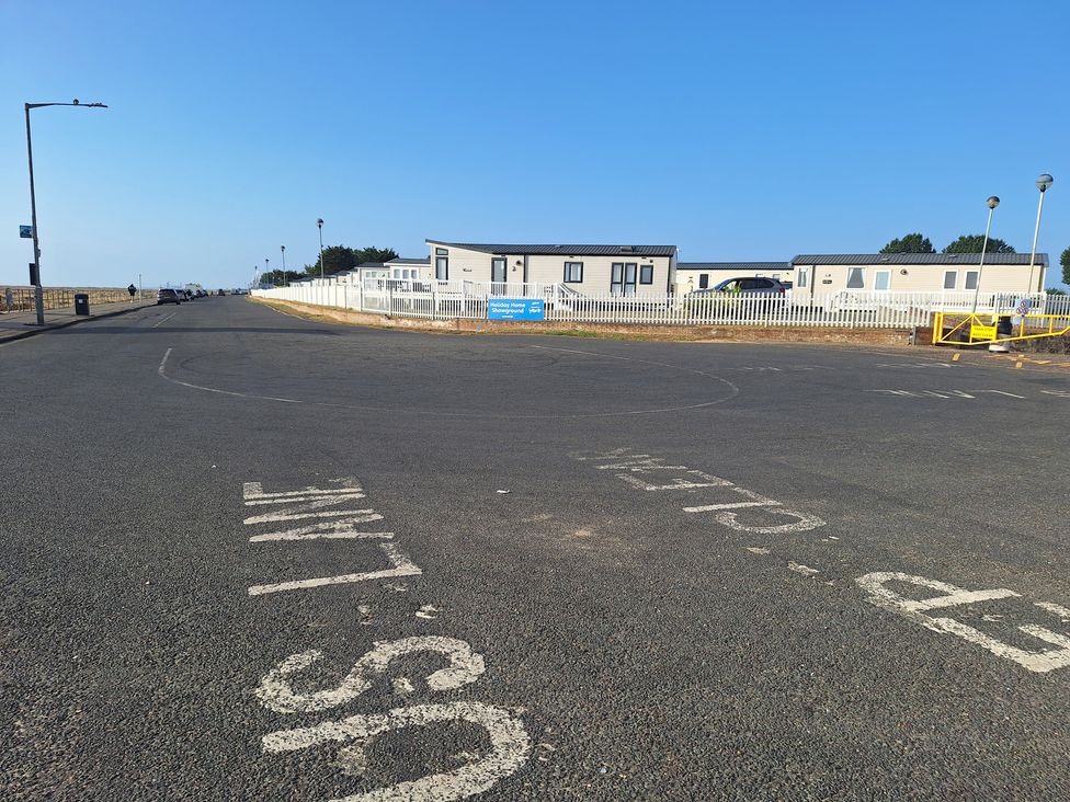 A street with caravan homes and road markings at Haven Seashore, Great Yarmouth