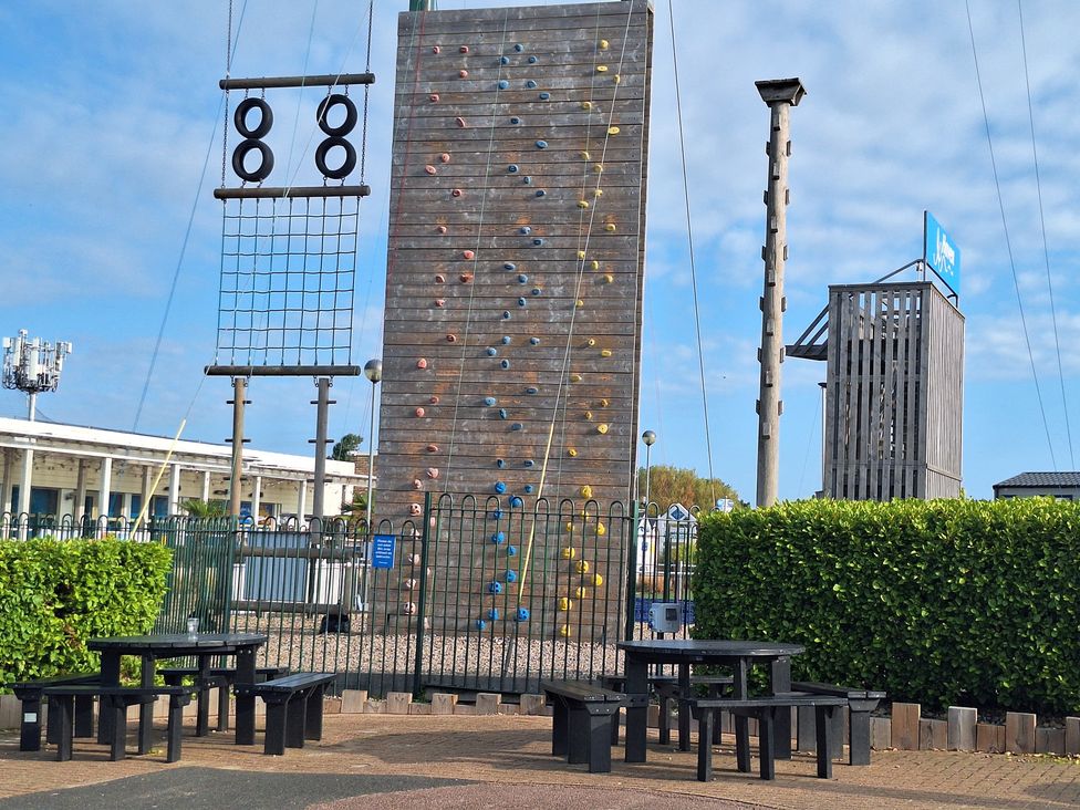 An outdoor climbing wall and benches at Haven Seashore, Ellerton Willerby Xtra in Great Yarmouth